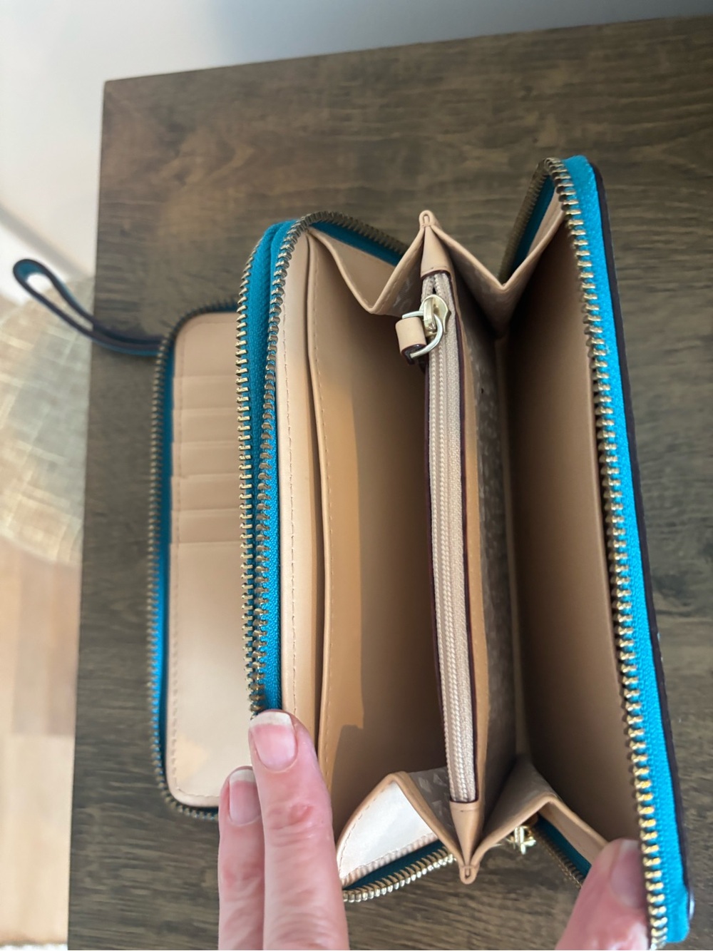 kate spade teal and tan zip-around wristlet clutch